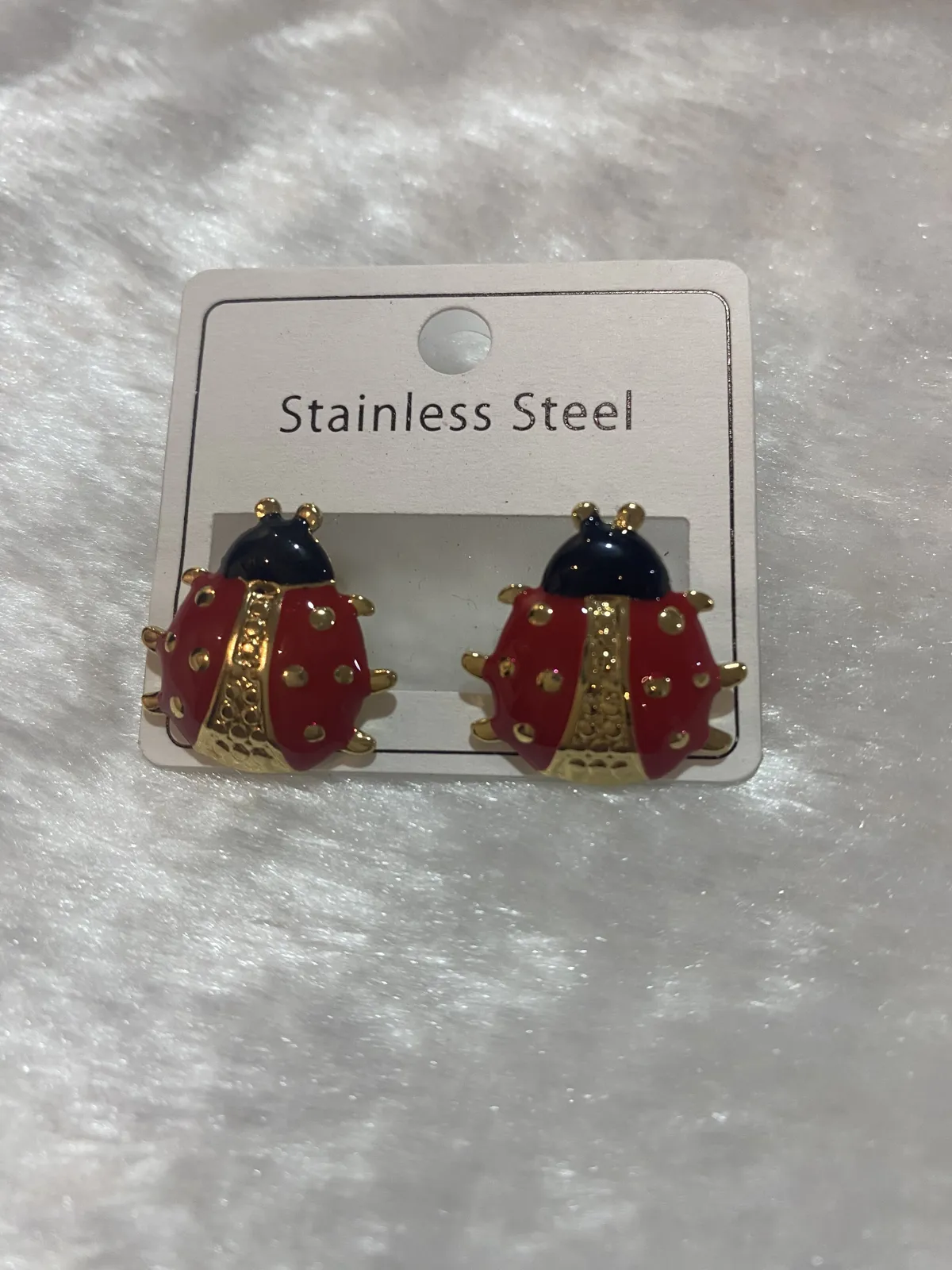 Aretes de acero inoxidable dorado 